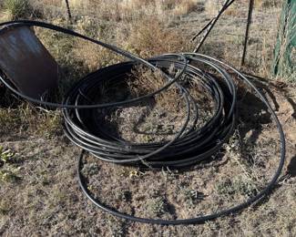 Lot #185- Coiled Black Plastic Irrigation Tubing