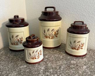 Lot #105- Four-Piece Wheat & Floral Ceramic Canister Set