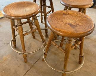 Lot #228- Four Round-Seat Wood Bar Stools with Metal Footrests