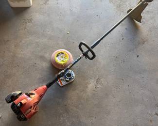 Lot #169- Homelite Gas String Trimmer with Extra Trimmer Line