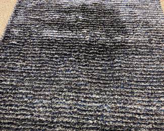 Navy, brown, silver area rug