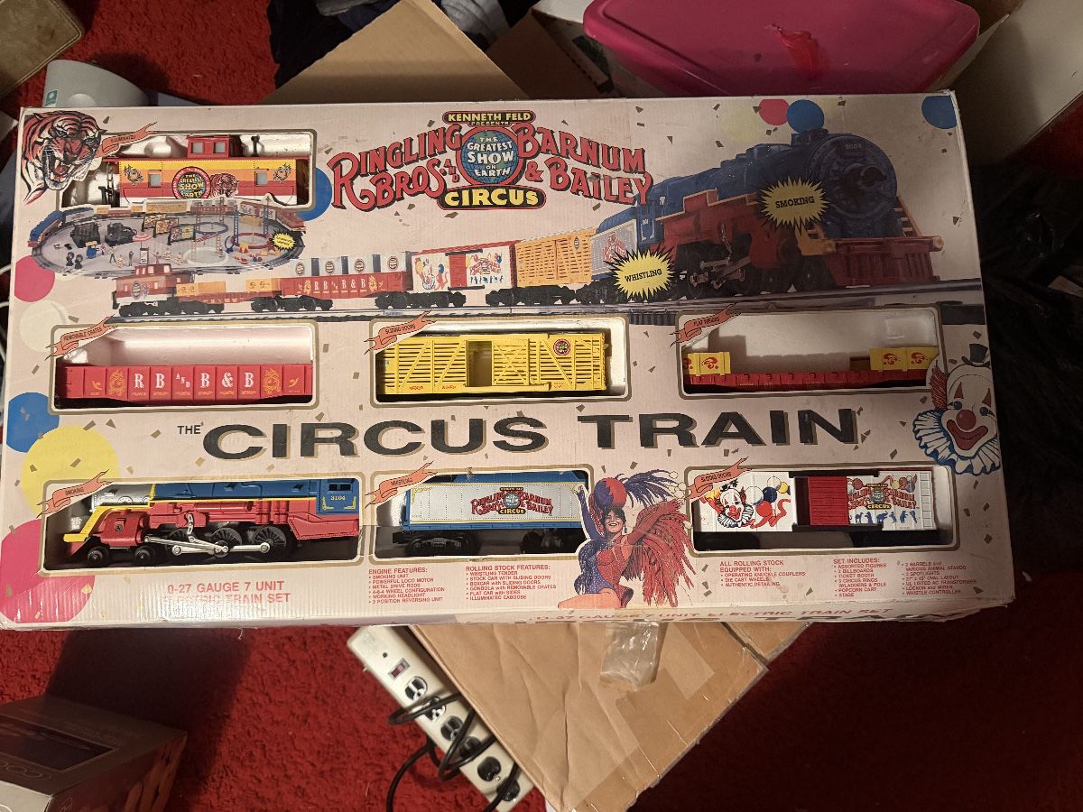 🚂🎪 **All Aboard the Circus Train!** How fun is this vintage Ringling Bros. and Barnum & Bailey Circus Train Set by K-Line?! A collectible O-27 gauge, 7-unit train set in its original box, featuring all the nostalgic charm of the greatest show on earth! Perfect for model train enthusiasts, circus memorabilia collectors, or anyone who loves a unique vintage find. 🎟️✨ *Completeness and operating condition have not been verified. Sold as-is.*