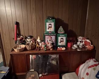 🎄 **And the Christmas treasures just keep coming!** Another corner downstairs filled with holiday goodies, including festive cookie jars, adorable Christmas character candles still in their original packaging, and plenty more seasonal surprises! Seriously, how much Christmas can one house hold?! 😂🎅