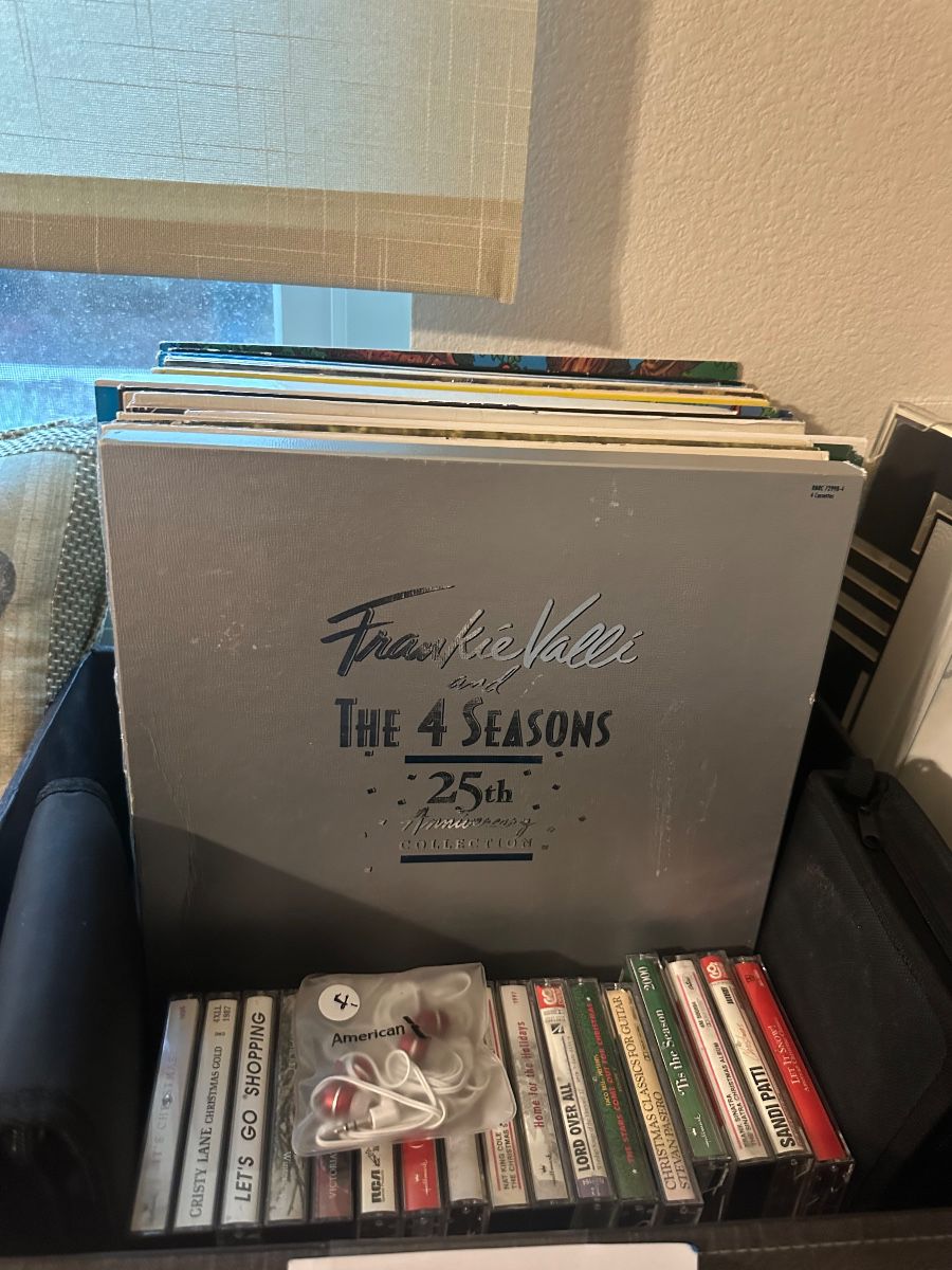 albums CDs tapes and ear buds