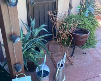 Watering Cans And Plant Stands