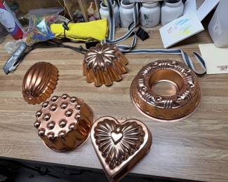 assorted copper molds and cookware
