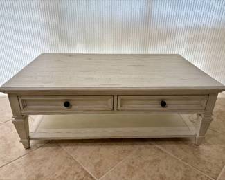 Haverty's Beckley Farmhouse distressed white coffee table with 2 drawer storage. Measurements: L - 50" / D - 30" / H - 15"