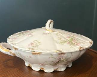 Lot 13: Theodore Haviland Limoges porcelain covered vegetable tureen or casserole dish with pink floral (rose) decals or hand-painted accents, scalloped edges, and gilt (gold) trim. • Origin: Crafted