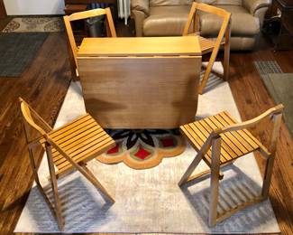 *Vintage Mid-Century Modern Solid Wood Hideaway Drop Leaf Dining Set, Table With 4 Folding Chairs - 5 PCS Pre 1980’s Total of 63 inches Long when Expanded x 34.5 inches Wide, When Compact the Table (with 4 Chairs Hidden Inside) is Only 12 inches Long x 34.5 inches Wide $985