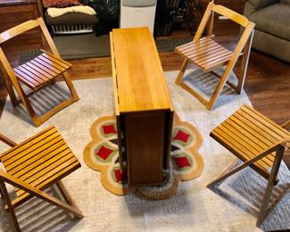 *Vintage Mid-Century Modern Solid Wood Hideaway Drop Leaf Dining Set, Table With 4 Folding Chairs - 5 PCS Pre 1980’s Total of 63 inches Long when Expanded x 34.5 inches Wide, When Compact the Table (with 4 Chairs Hidden Inside) is Only 12 inches Long x 34.5 inches Wide $985