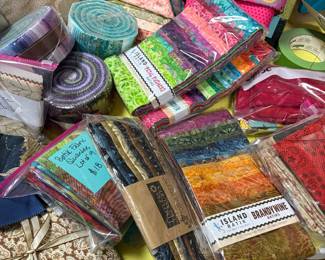 Brand new Layer cakes, Jelly Rolls and quilting material