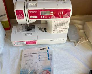 Brother Laura Ashley Sewing and Quilting machine. Missing power cord that can be replaced for $12. Next photo shows the shape for cord adapter in case you have one on hand and want to bring to test it.