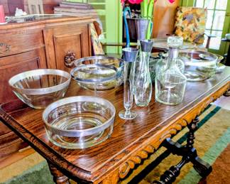 Library table with silver-rimmed serving pieces