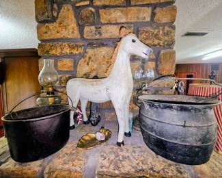 Cast iron kettles and horse figure