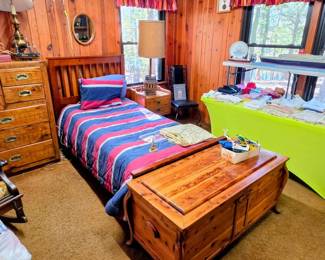 Twin bed and one of the many cedar chests available
