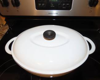 Large white Le Crueset Style casserole cookware.