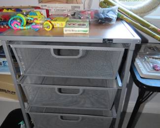 Rolling wire storage drawers.
