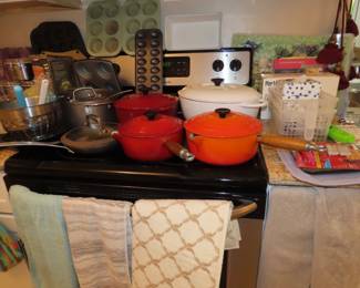 Le Crueset cookware and other kitchen items.