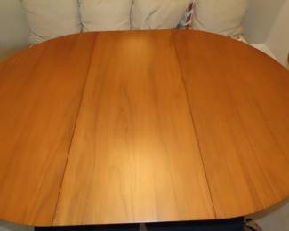 MCM dining table and four chairs.