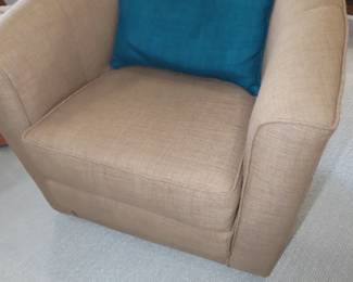 Beige fabric swivel barrel/club chair.