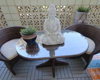 Patio table and two hidden chairs.