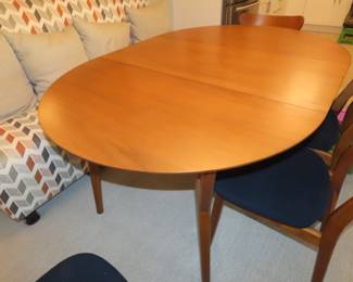 MCM dining table and four chairs.