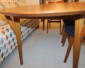 MCM dining table and four chairs.