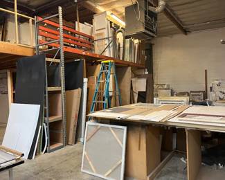 Metal rack, more framed artwork