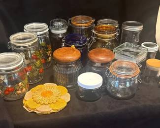 Vintage Glass Storage Containers And Needlepoint Wall Hanging