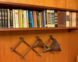 Various vintage books and two antique funnels 