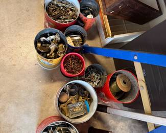 Jars and jars, hundreds probably of nuts, bolts, screws, latches, wire, etc