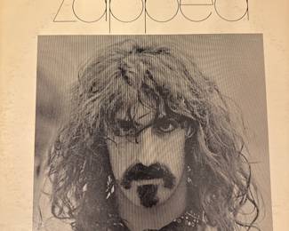 Frank Zappa album cover featuring a black-and-white portrait.