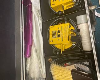 DeWalt equipment, cables, and accessories in a fitted case.