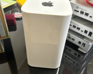 Apple desktop tower computer with silver enclosure.
