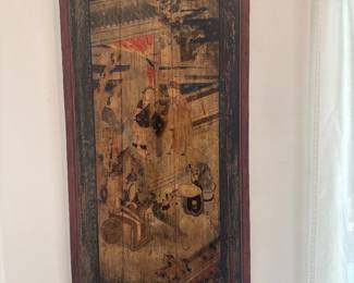 Framed decorative artwork with an intricate scene in warm earth tones.