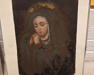 Framed portrait artwork depicting a seated woman in dark clothing.