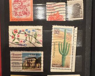 International postage stamps featuring botanical and architectural designs.