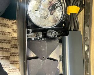 Portable photographic flash or lighting equipment in a fitted case.