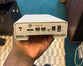 Compact desktop computer with multiple USB and display connections.