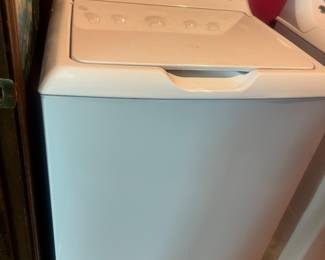 White top-loading washing machine.