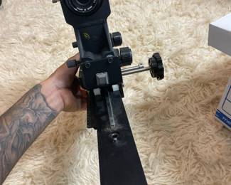 Adjustable camera tripod head and mounting hardware.
