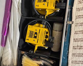 DeWalt worksite equipment and accessories stored in a carrying case.
