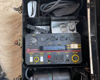Portable audio recorder or mixer with multiple input controls and carrying case.