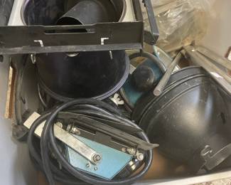 Assorted pots, pans, and cookware stored in a cabinet.