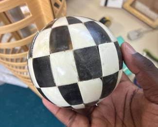 Decorative black-and-white checkered sphere.