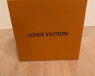 Orange Louis Vuitton-branded presentation box; packaging shown.