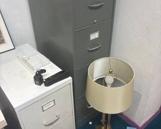 Metal filing cabinets and a table lamp.