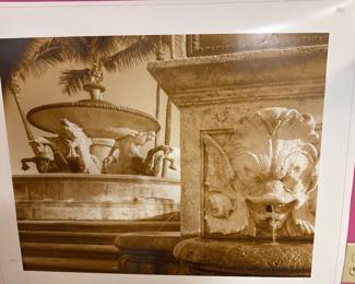 Framed photograph of an elaborate fountain with sculptural details.
