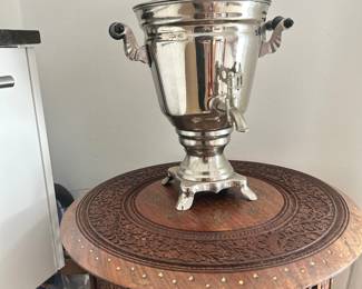 Metal samovar-style tea urn with side handles and serving spout.