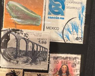 International postage stamps including Mexico, displayed in an album.